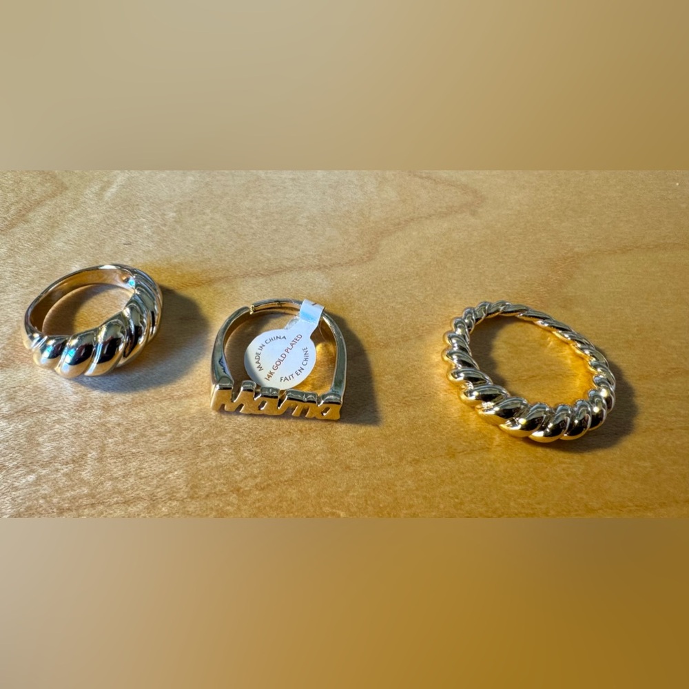 Set of three rings from Anthropologie. 14K gold plate, one with the word “mama.”